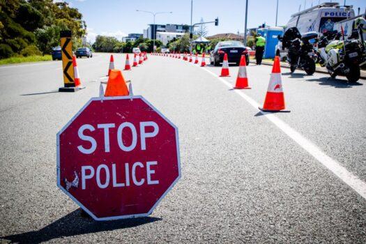 A vehicle stops at a checkpoint on the Pacific Highway on the Queensland - New South Wales border in Brisbane on April 15, 2020. (Patrick Hamilton/AFP /AFP via Getty Images)