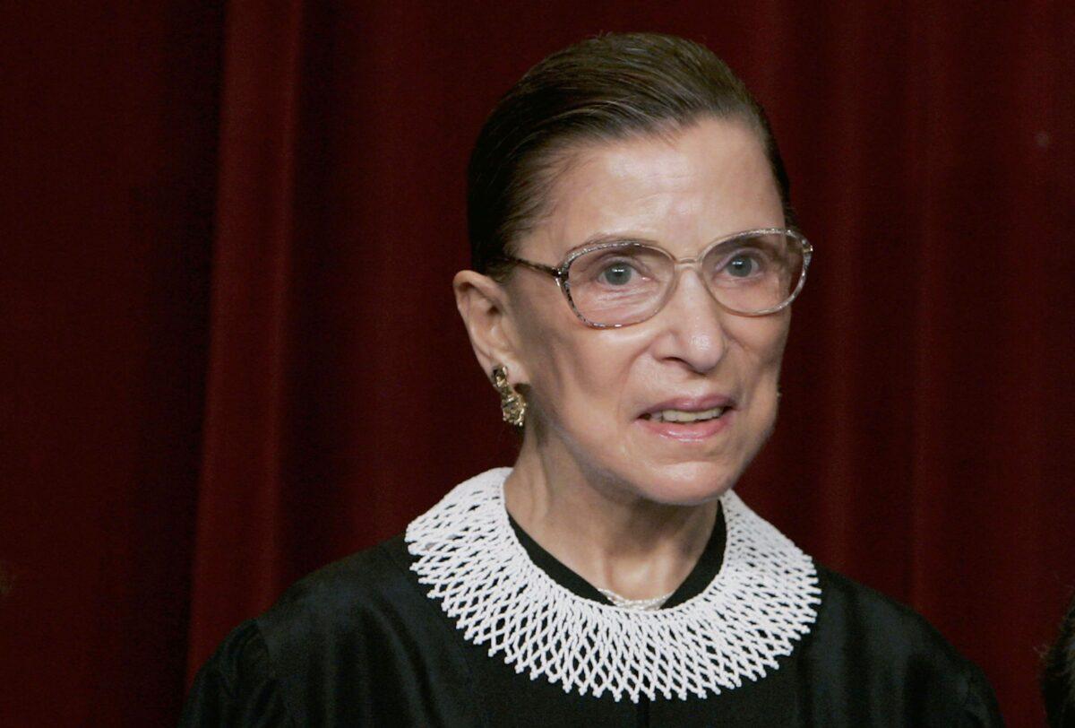 Supreme Court Justice Ruth Bader Ginsburg smiles during a photo session with photographers at the Supreme Court in Washington on March 3, 2006. (Mark Wilson/Getty Images)