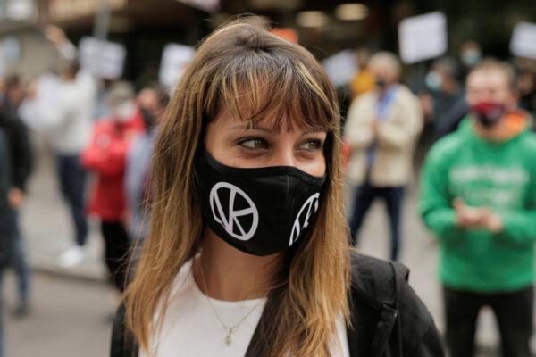 A woman takes part in protest in front of the Madrid regional government's health office over the lack of support and movement on improving working conditions at the Vallecas neighborhood, amid the outbreak of the coronavirus disease (COVID-19) in Madrid, on Sept. 20, 2020. (Javier Barbancho/Reuters)