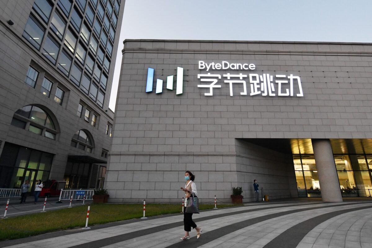  A woman walks past the headquarters of ByteDance, the parent company of video sharing app TikTok, in Beijing on Sept. 16, 2020. (Greg Baker/AFP via Getty Images)