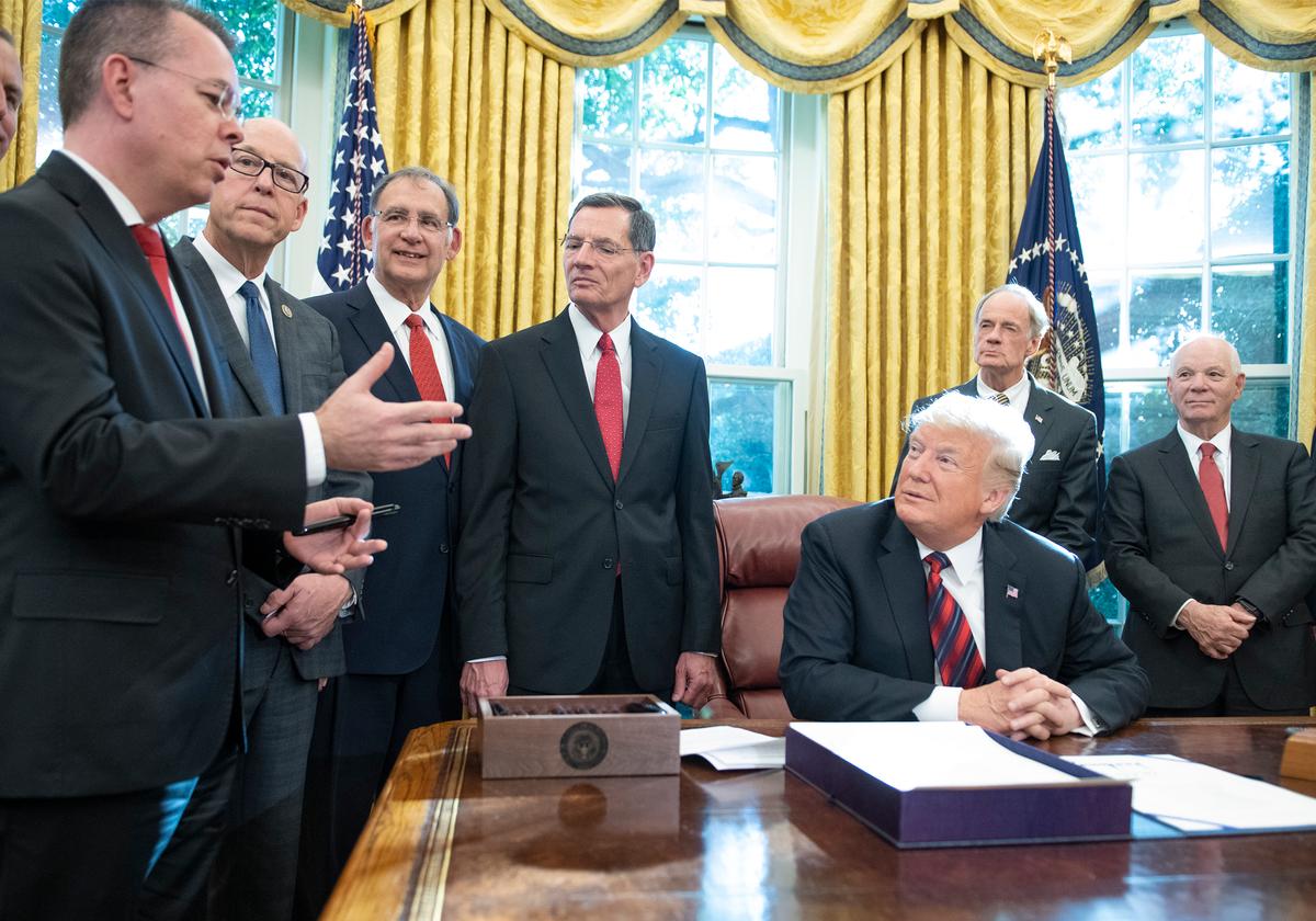 Also pictured from left to right: Rep. Greg Walden (R-Ore.), Sens. John Boozman (R-Ark.), John Barrasso (R-Wyo.), Tom Carper (D-Del.), and Ben Cardin (D-Md.). (Ron Sachs/Getty Images)