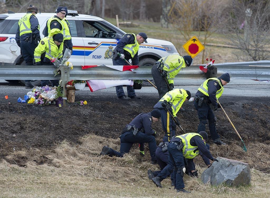 RCMP investigators search for evidence at the location where Const. Heidi Stevenson was killed along the highway in Shubenacadie, N.S., on April 23, 2020. Court documents describe the violence a Nova Scotia mass killer inflicted on his father years before his rampage on April 18<span style="font-weight: 400;">–</span>19, 2020, in Nova Scotia, as well as the gunman's growing paranoia before the shootings and killings. (The Canadian Press/Andrew Vaughan)