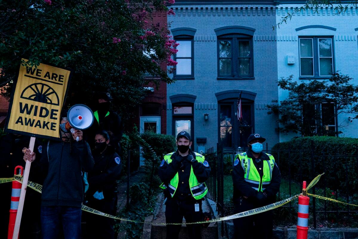 Demonstrators gather outside the home of Sen. Lindsey Graham (R-S.C.) in Washington on Sept. 21, 2020. (Alex Edelman/AFP via Getty Images)