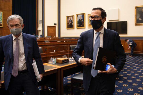 Federal Reserve Chair Jerome Powell (L) and Treasury Secretary Steve Mnuchin depart from a House Financial Services Committee hearing on the Treasury Department's and Federal Reserve's CCP virus pandemic response at the U.S. Capitol in Washington, on Sept. 22, 2020. (Caroline Brehman-Pool/Getty Images)