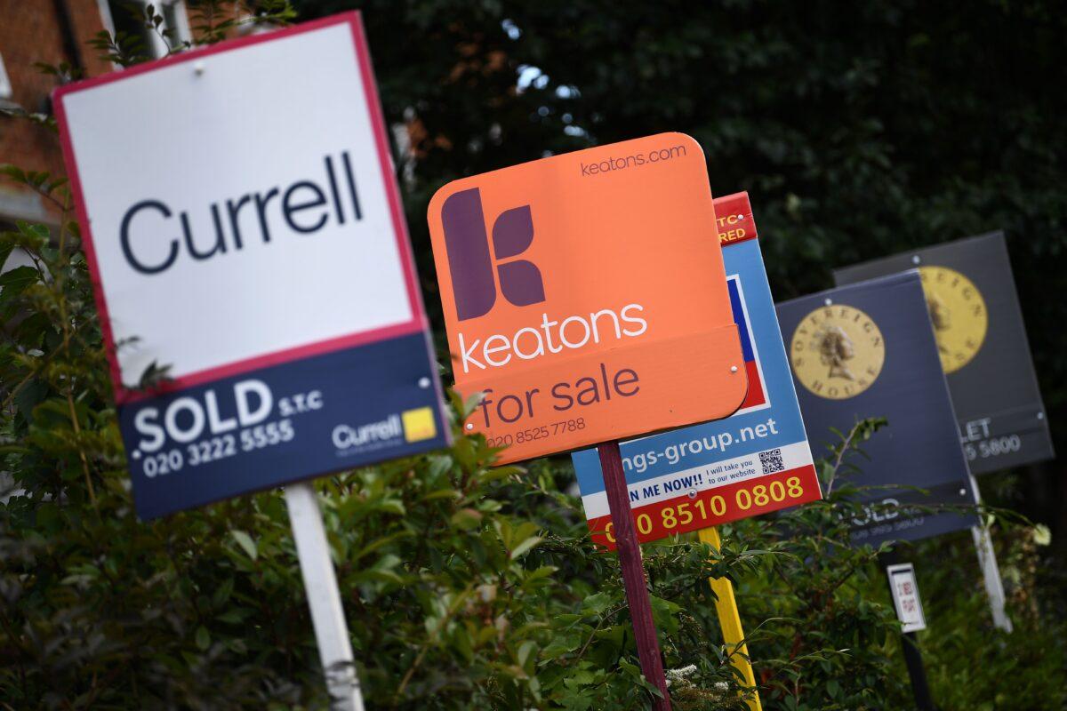 Estate and rental agents' boards are pictured on a residential street in Hackney, East London, on Aug. 9, 2019. (Daniel Leal-Olivas/AFP via Getty Images)