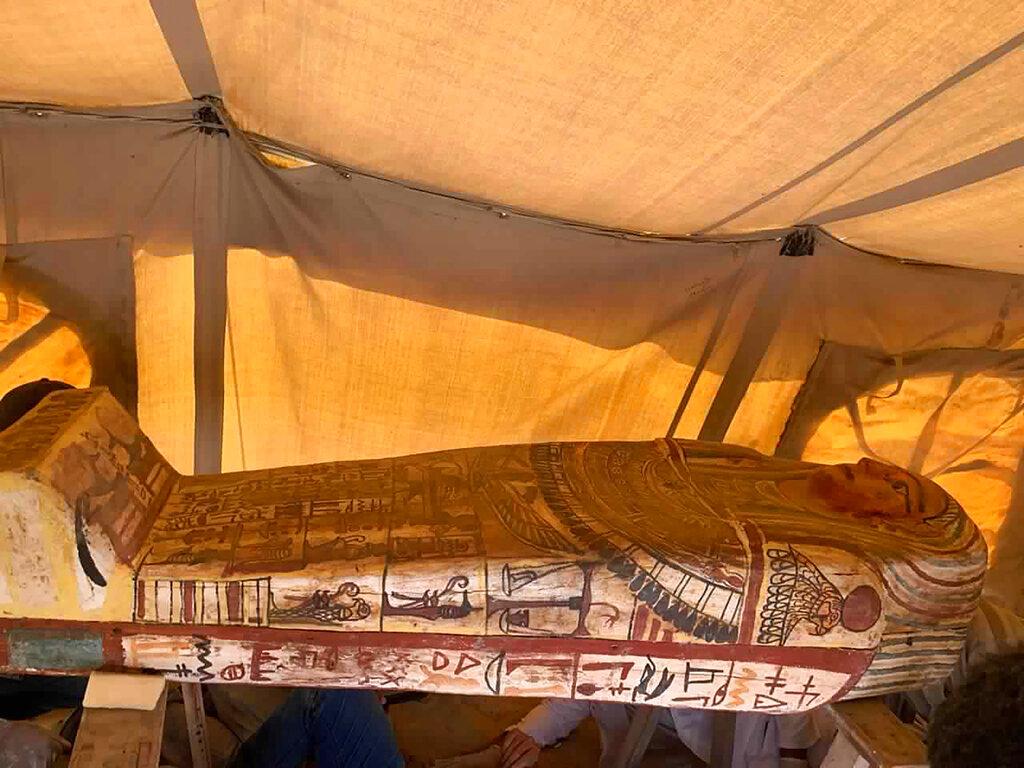 The picture shows one of more than two dozen ancient coffins unearthed near the famed Step Pyramid of Djoser in Saqqara, south of Cairo, Egypt. (Ministry of Tourism and Antiquities via AP)