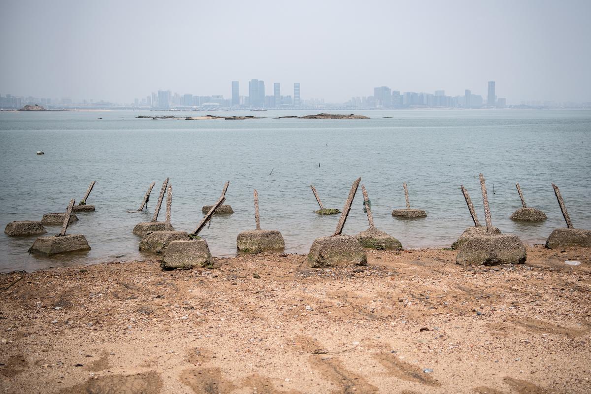 Aged anti-landing barricades are positioned on a beach facing China on the Taiwanese island of Little Kinmen on April 20, 2018. (Carl Court/Getty Images)