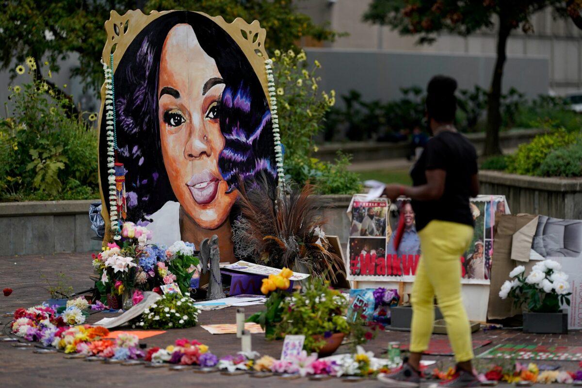 A woman visits the memorial for Breonna Taylor, in Louisville, Ky., Sept. 11, 2020. (Bryan Woolston/Reuters)