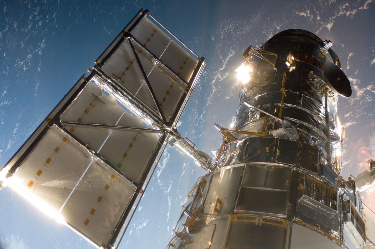 The Hubble Space Telescope in a picture snapped by a Servicing Mission 4 crewmember just after the Space Shuttle Atlantis captured Hubble with its robotic arm on May 13, 2009. (<a href="https://commons.wikimedia.org/wiki/File:Space_Telescope_Hubble_2009.jpg">NASA/JSC</a>/Wikimedia Commons)
