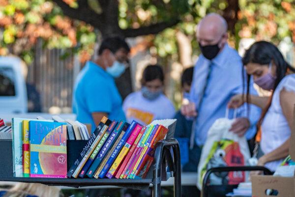 People browse the books at a book drive at Westminster Library in Westminster, Calif., on Sept. 22, 2020. (John Fredricks/The Epoch Times)