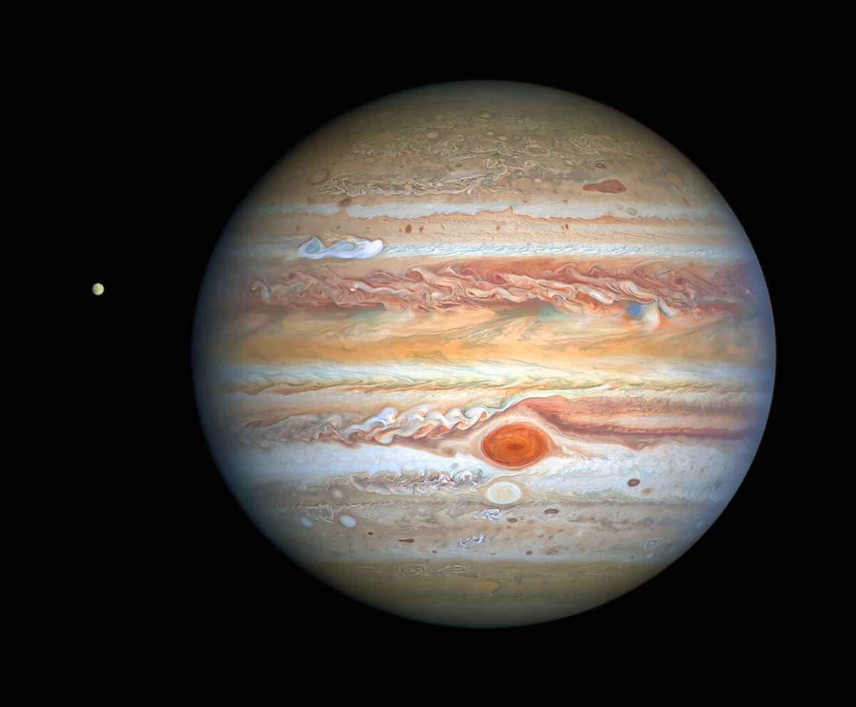 Hubble’s sharp view of Jupiter is giving researchers an updated weather report on the monster planet’s turbulent atmosphere, and a view of Jupiter’s icy moon, Europa. (<a href="https://www.spacetelescope.org/images/heic2017a/">NASA, ESA, A. Simon (Goddard Space Flight Center), and M. H. Wong (University of California, Berkeley) and the OPAL team.</a>)