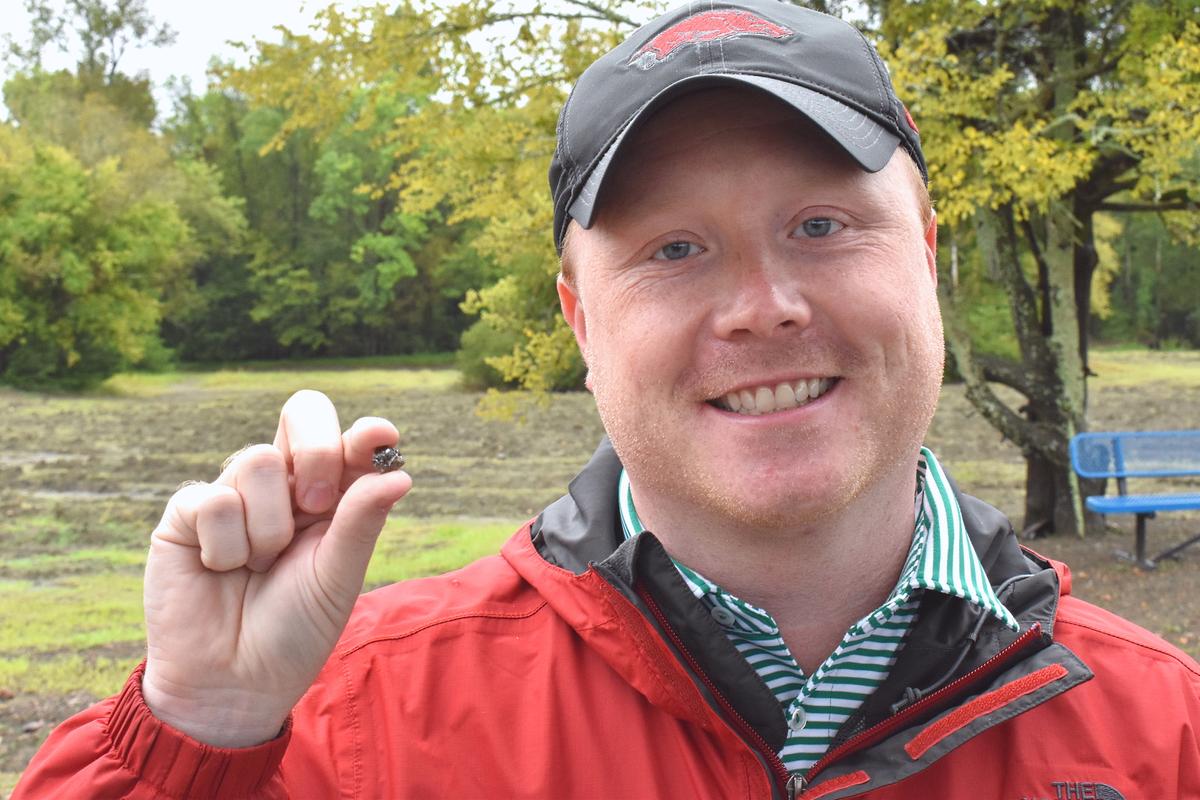 Kevin Kinard with his 9.07-carat find. (<a href="https://www.arkansasstateparks.com/news/visitor-finds-9-carat-diamond-crater-diamonds-state-park">The State Parks of Arkansas</a>)