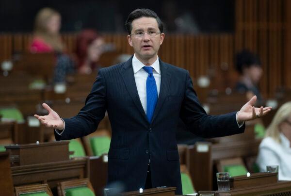 Conservative MP Pierre Poilievre rises in the House of Commons after the government delivered a fiscal snapshot in Ottawa on July 8, 2020. (Adrian Wyld/The Canadian Press)