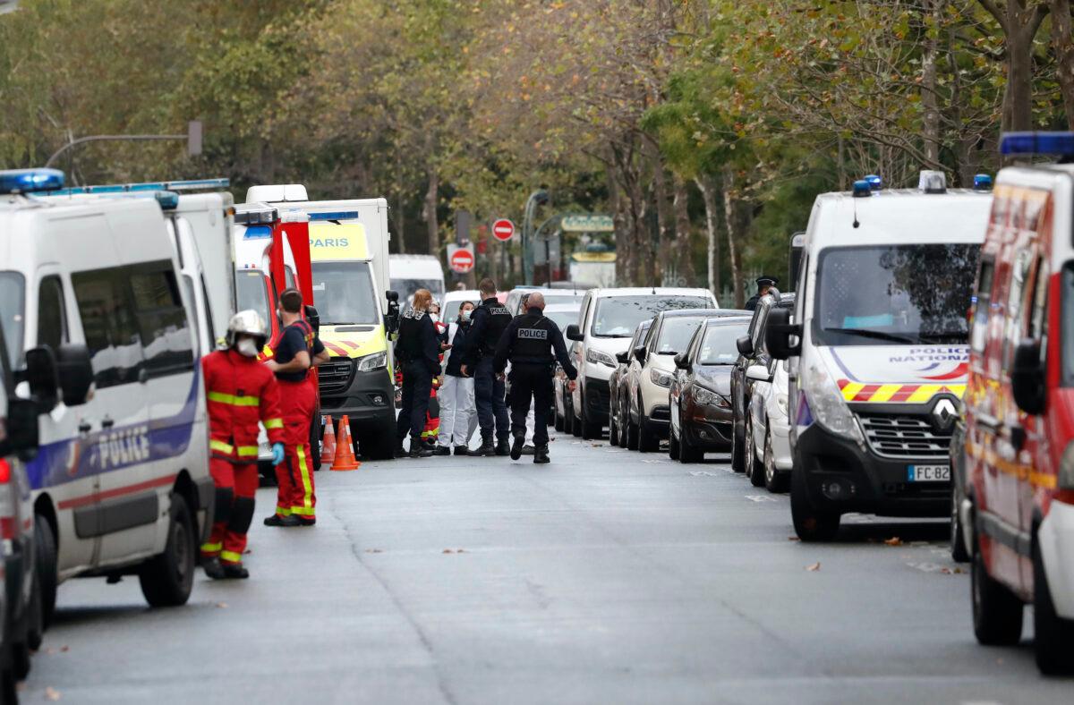 French police officers and rescue workers gather after two people have been wounded in a knife attack near the former offices of satirical newspaper Charlie Hebdo, Paris, on Sept. 25, 2020. (Thibault Camus/AP Photo)