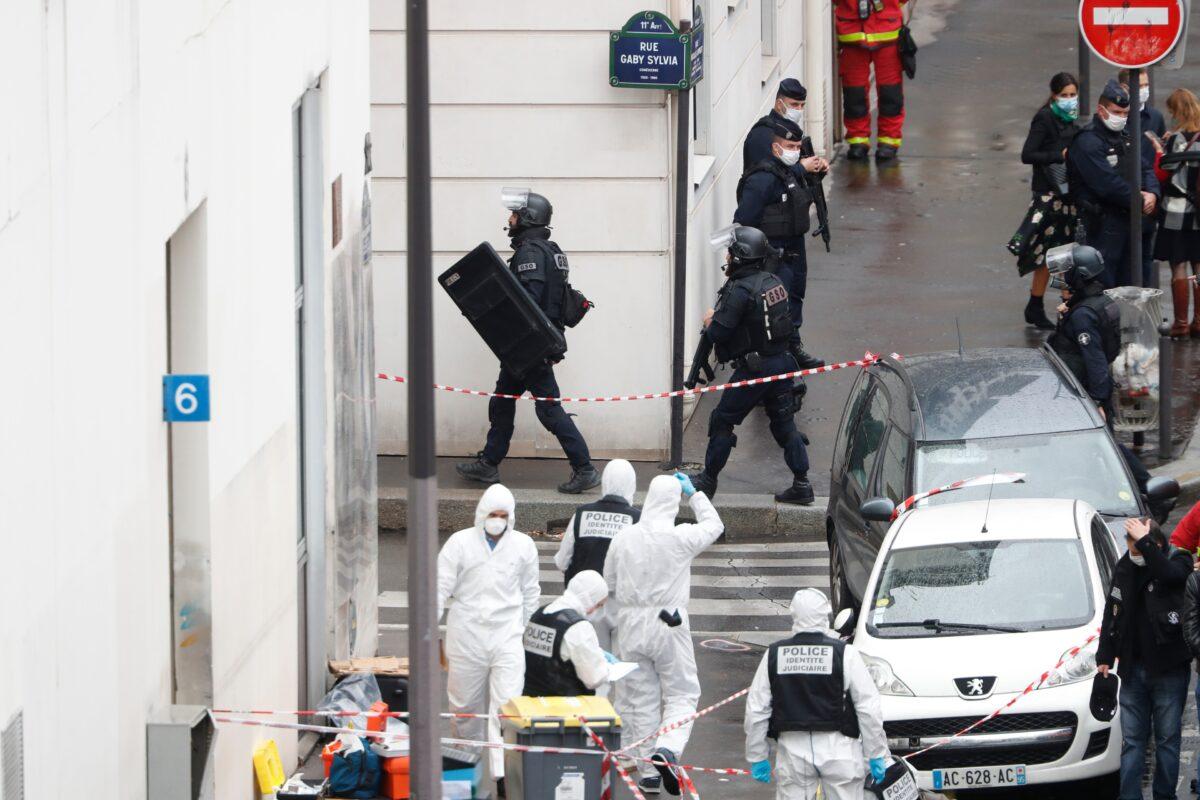 Police at the scene of a knife attack near the former offices of satirical newspaper Charlie Hebdo, in Paris, on Sept. 25, 2020. (Thibault Camus/AP Photo)