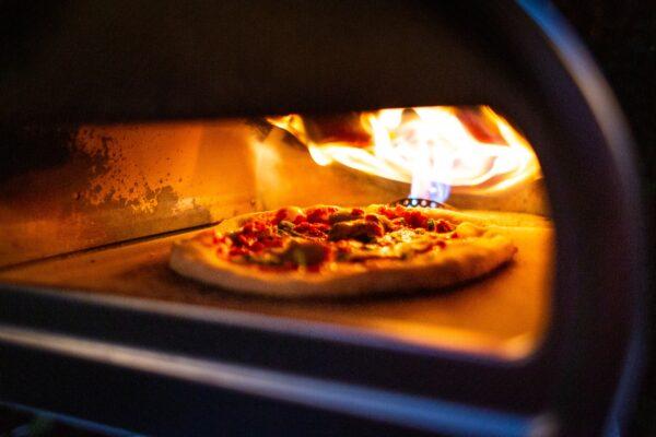 A pizza in the oven at Gene Pietrini's home in Seal Beach, Calif., on Sept. 19, 2020. (John Fredricks/The Epoch Times)