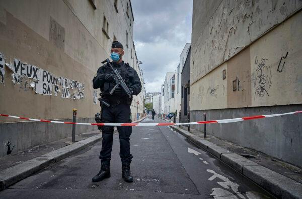 Armed police secure the area of around the former Charlie Hebdo headquarters, and scene of a previous terrorist attack in 2015, after two people were stabbed on Sept. 25, 2020 in Paris, France. (Kiran Ridley/Getty Images)