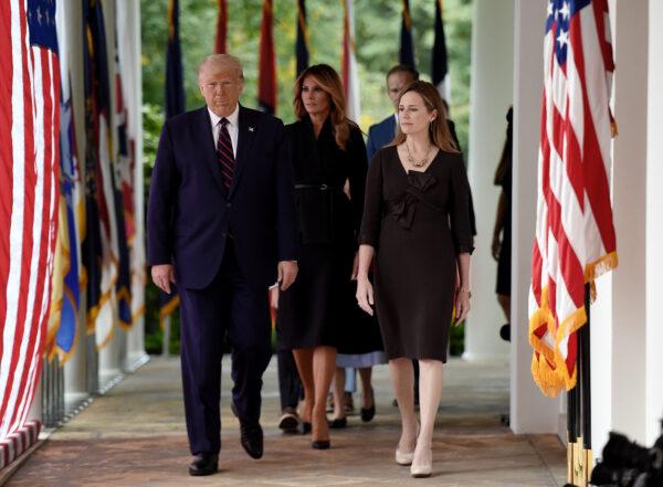 Seventh U.S. Circuit Court Judge Amy Coney Barrett's family and First Lady Melania Trump watch during Barrett's Supreme Court nomination ceremony, at the White House in Washington on Sept. 26, 2020. (Olivier Douliery/AFP via Getty Images)