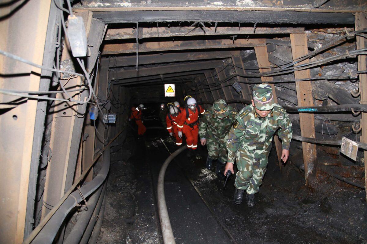 Rescuers race against time to pump water from a flooded coal mine where 22 miners were trapped underground in Qujing, Yunnan Province of China, on April 7, 2014. (Getty Images)