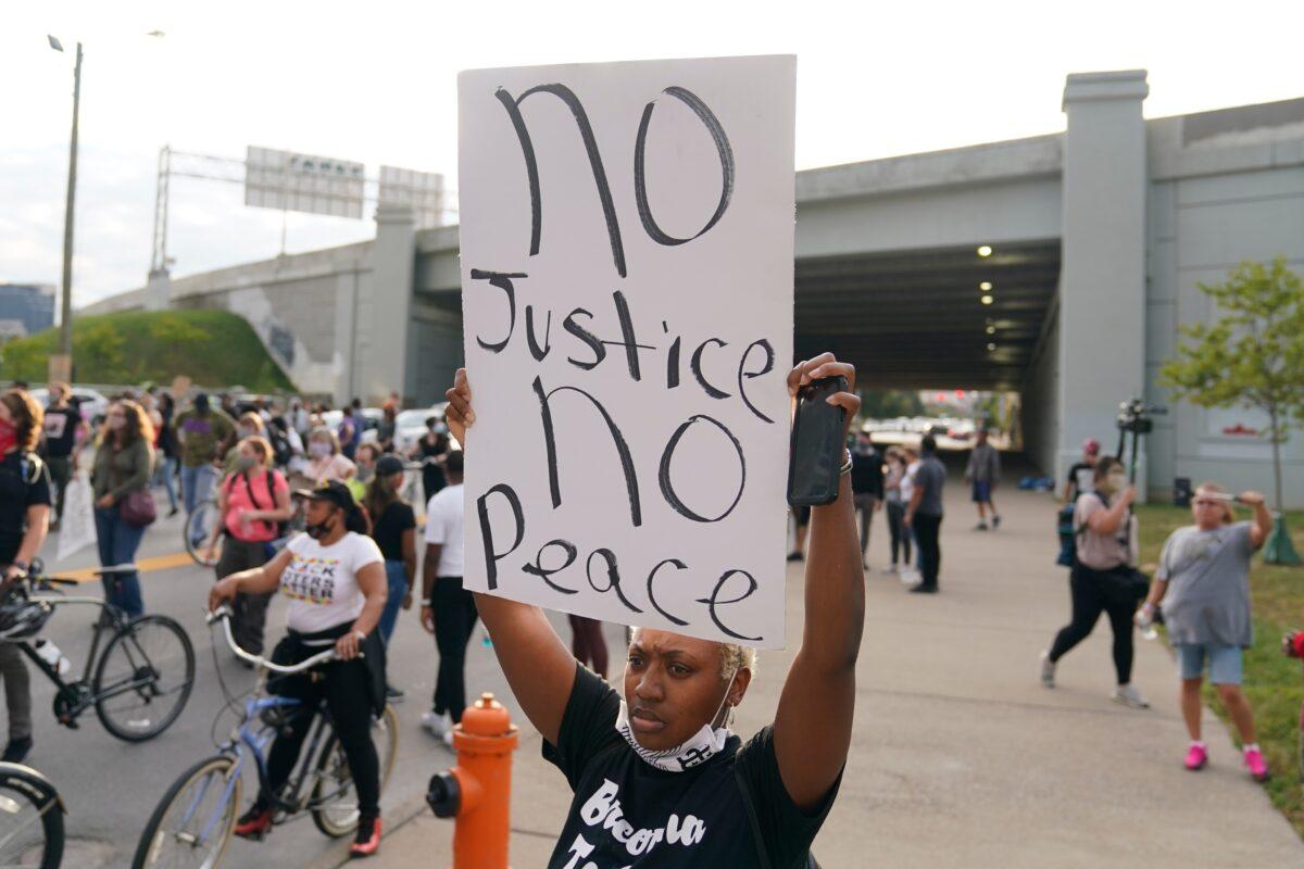 Victoria Gunther marches with Black Lives Matter protesters, in Louisville. Ky., on Sept. 25, 2020. (Darron Cummings/AP Photo)