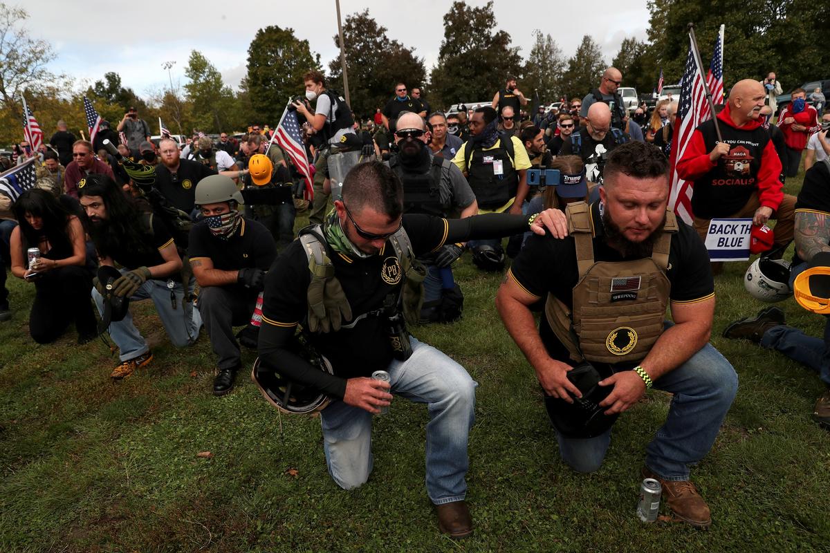 People pray during a Proud Boys rally in Portland, Ore., on Sept. 26, 2020. (Leah Millis/Reuters)