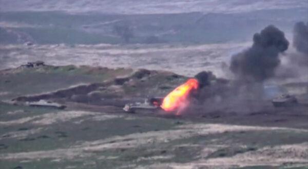 Azerbaijani armored vehicles, one of which is destroyed by Armenian armed forces in the breakaway region of Nagorno-Karabakh, are shown in this still image from footage released on Sept. 27, 2020. (Defense Ministry of Armenia/Handout via Reuters)