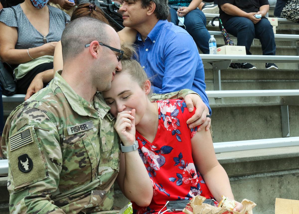 The Arrowhead soldiers and their families gathered for the ceremony and said their final farewells as the headquarters soldiers loaded the buses to leave. (<a href="https://www.dvidshub.net/image/6371410/36th-infantry-division-deployment-casing-ceremony">Staff Sgt. Michael Giles</a>/36th Infantry Division Public Affairs/U.S. Army)