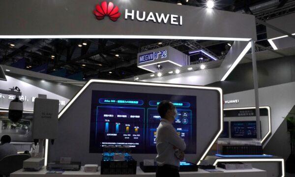 A man walks past a Huawei booth at the 2020 China International Fair for Trade in Services in Beijing on Sept. 4, 2020. (Tingshu Wang/Reuters)