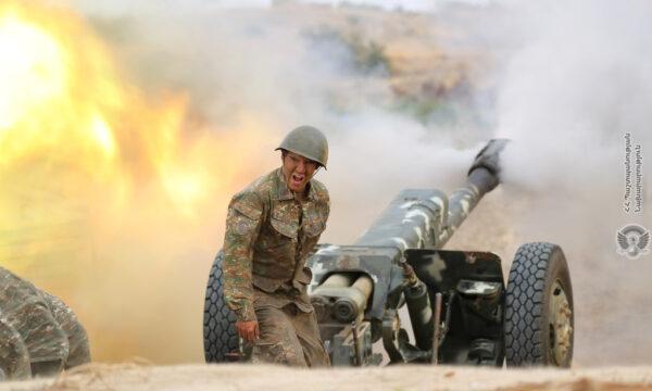 An ethnic Armenian soldier fires an artillery piece during fighting with Azerbaijan's forces in the breakaway region of Nagorno-Karabakh, in this handout picture released on Sept. 29, 2020. (Defense Ministry of Armenia/Handout via Reuters)