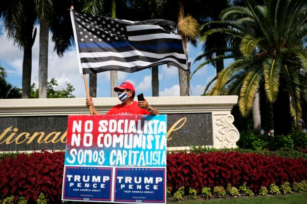 Supporters of President Donald Trump rally outside the "Latinos for Trump Roundtable" event at Trump National Doral Miami golf resort in Doral, Fla., on Sept. 25, 2020. (Marco Bello/AFP via Getty Images)