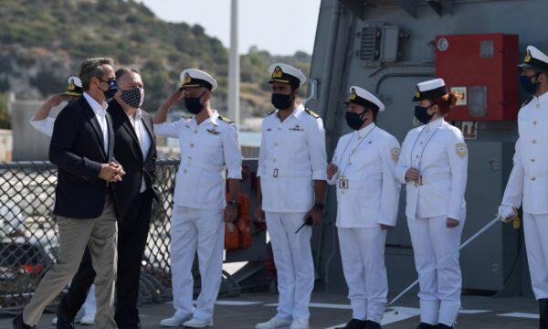  U.S. Secretary of State Mike Pompeo and Greek Prime Minister Kyriakos Mitsotakis are saluted as they walk towards the Greek frigate Salamis during their visit to the Naval Support Activity base at Souda, Crete, Greece, on Sept. 29, 2020. (Aris Messinis/Pool via Reuters)