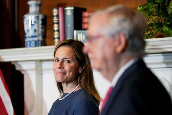 Senate Majority Leader Mitch McConnell (R-Ky.) meets with Supreme Court nominee Judge Amy Coney Barrett on Capitol Hill in Washington on Sept. 29, 2020. (Susan Walsh/Pool via Reuters)