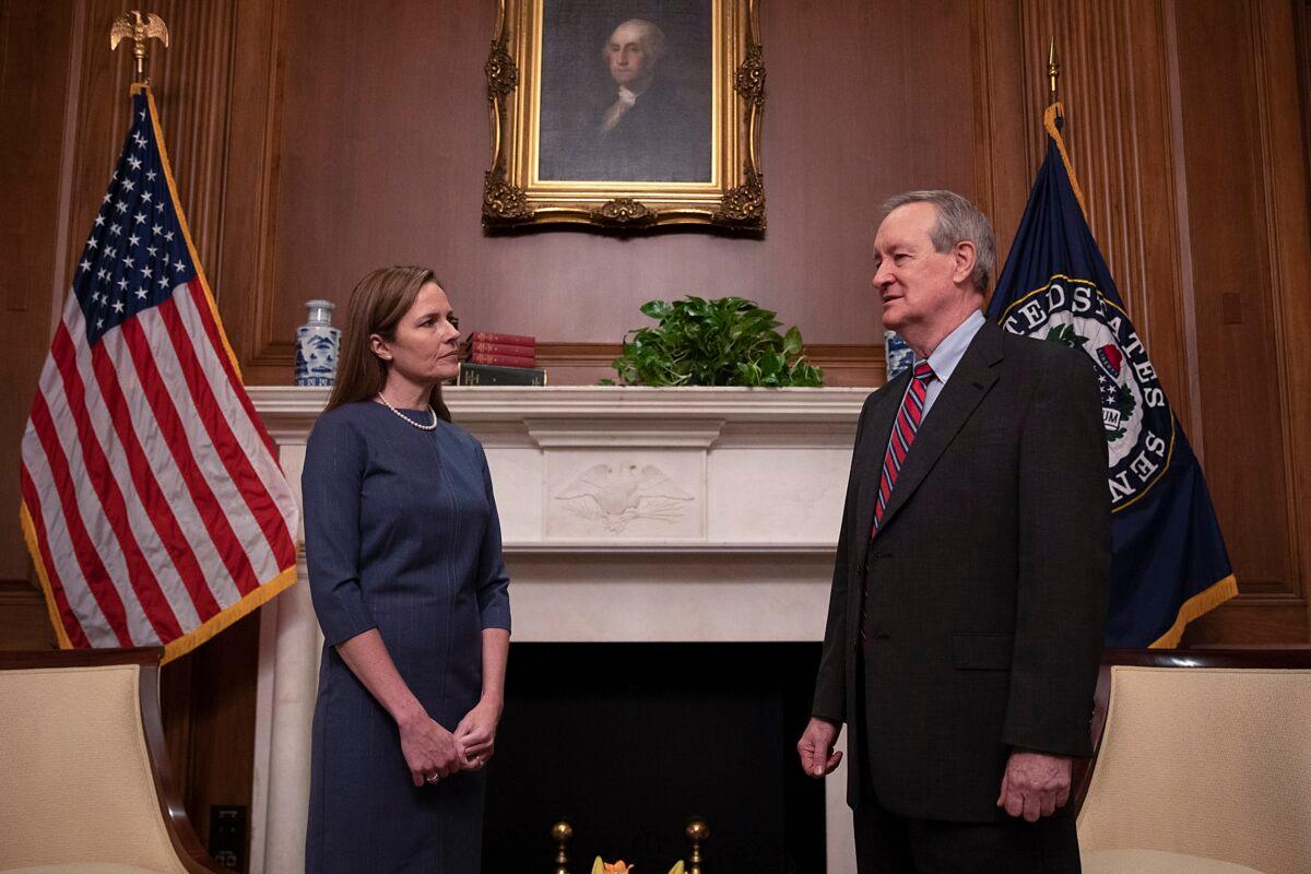 Supreme Court nominee Judge Amy Coney Barrett meets with Senator Mike Crapo (R-Idaho) on Capitol Hill in Washington on Sept. 29, 2020. (Tasos Katopodis/Getty Images)