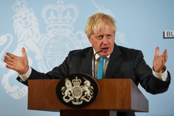 British Prime Minister Boris Johnson delivers a speech at Exeter College Construction Centre, part of Exeter College in Exeter, Britain, on Sept. 29, 2020. (Finnbarr Webster/Pool via Reuters)
