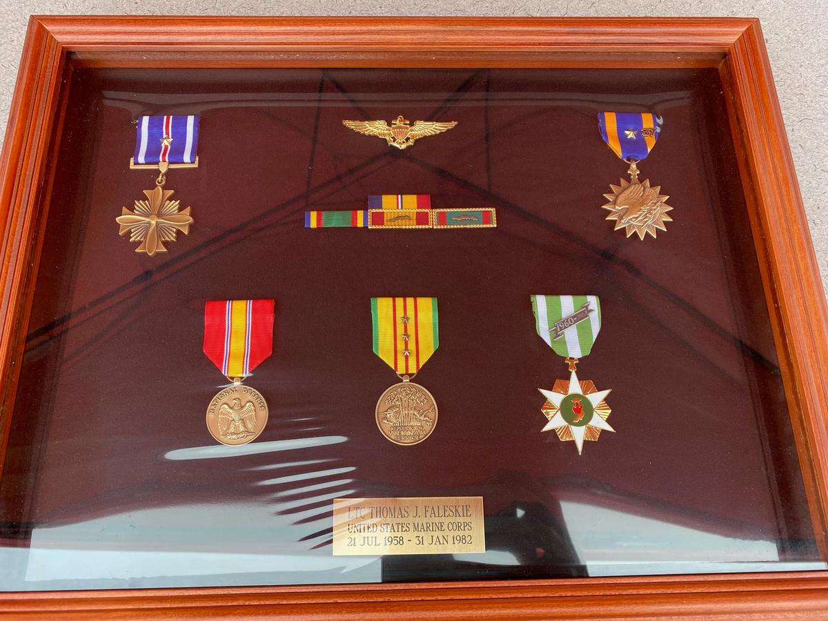 The shadowbox contains replacements of Lt. Col. Thomas Faleskie's medals, ribbons, and pilot's wings. (Courtesy of Spotsylvania Sheriff's Office)