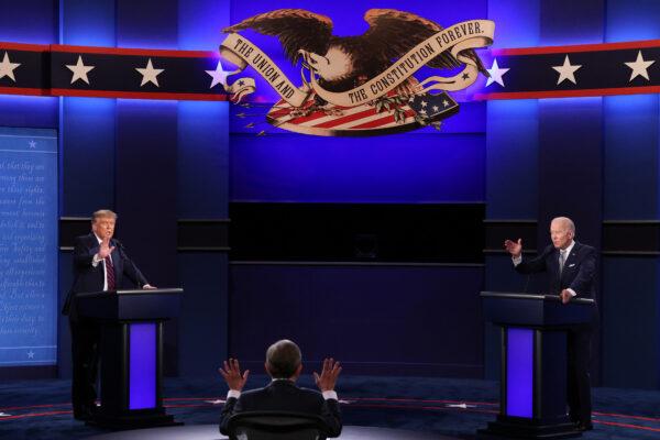 President Donald Trump and Democratic presidential nominee Joe Biden participate in the first presidential debate moderated by Fox News anchor Chris Wallace (C) at the Health Education Campus of Case Western Reserve University in Cleveland, Ohio, on Sept. 29, 2020. (Scott Olson/Getty Images)