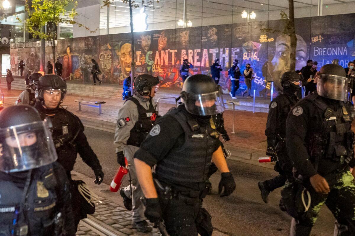 Portland police disperse a crowd of protesters in Portland, Ore., on Sept. 26, 2020. (Nathan Howard/Getty Images)