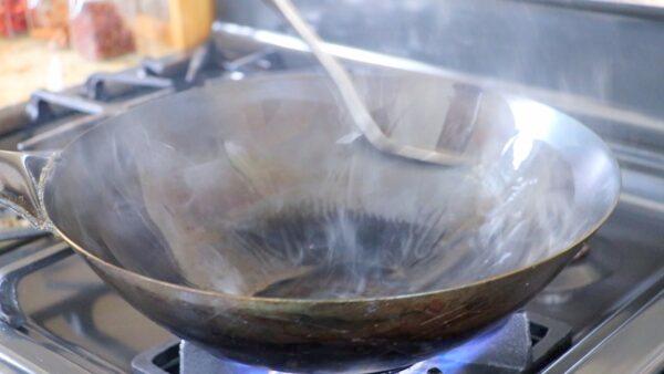 Give the wok a nonstick coating. (CiCi Li)