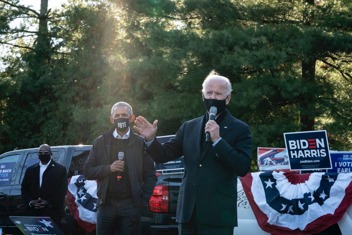 Democratic presidential nominee Joe Biden and former President Barack Obama make a stop at a canvass kickoff event at Birmingham Unitarian Church in Bloomfield Hills, Mich., on Oct. 31, 2020. (Drew Angerer/Getty Images)