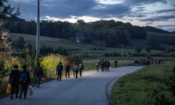 Migrants walk towards the Bosnia-Croatia border in hopes of slipping across it, near Velika Kladusa, Bosnia, on Sept. 29, 2020. (Marko Djurica/Reuters)