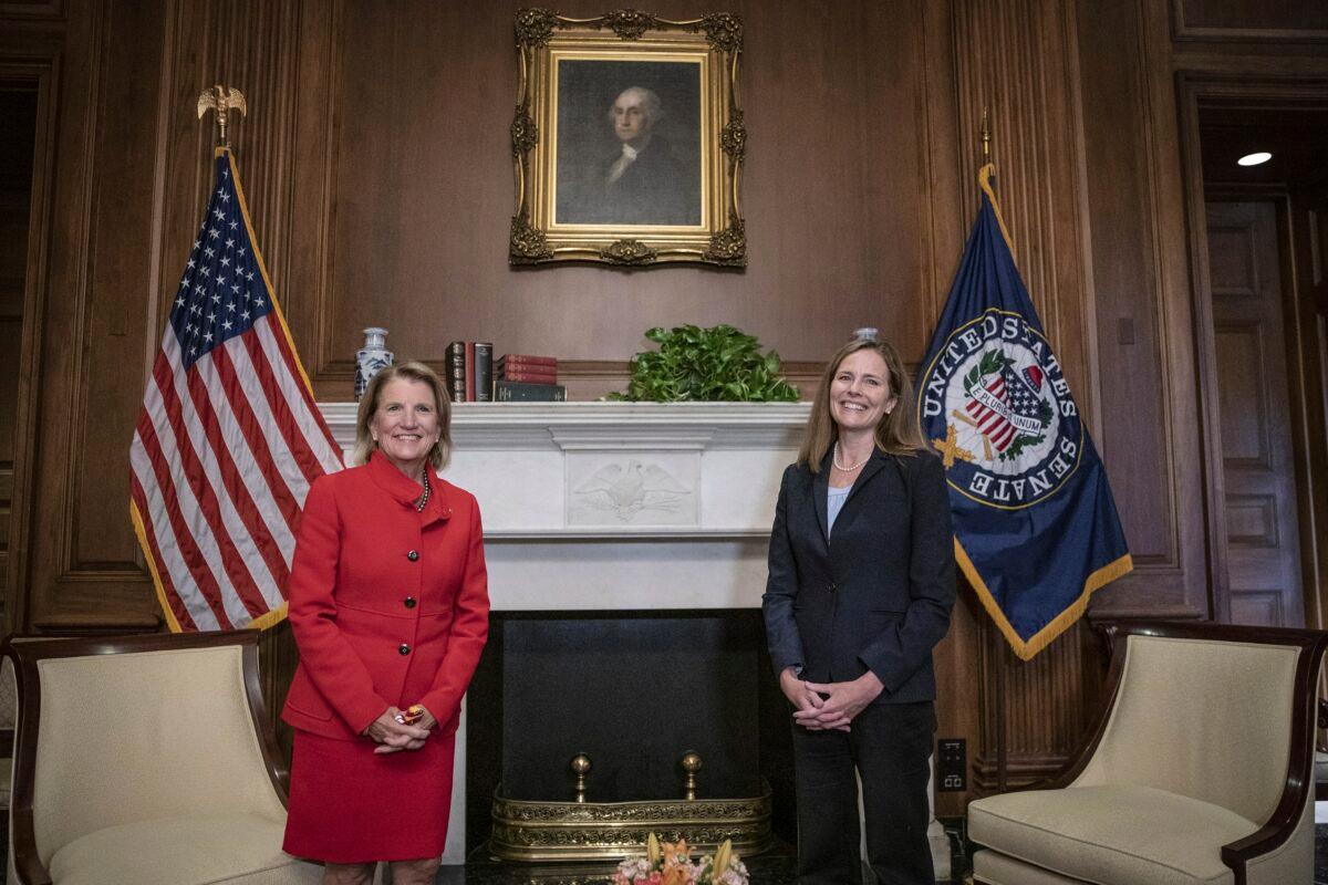 Sen. Shelley Moore Capito (R-W.Va.) meets with Judge Amy Coney Barrett, President Donald Trump's nominee for the Supreme Court, on Capitol Hill in Washington on Sept. 30, 2020. (Sarah Silbiger/Pool via AP)