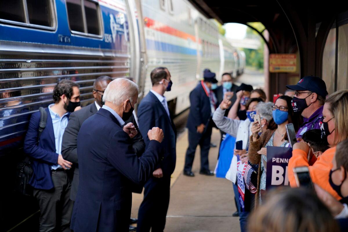 Democratic presidential nominee Joe Biden greets supporters on the platform outside the Amtrak's Greensburg Train Station in Greensburg, Pa., Sept. 30, 2020. (Andrew Harnik/AP Photo)