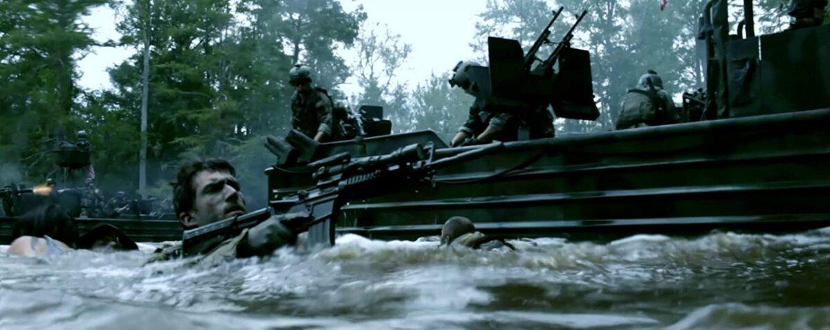 Navy SEAL sniper Weimy returning fire alongside a SOC-R boat in "Act of Valor." (Relativity Media)