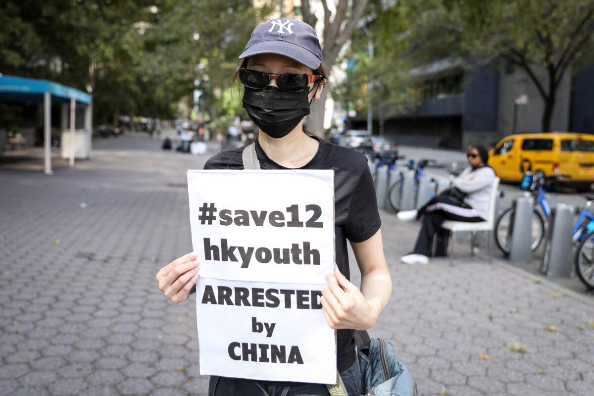 A woman who identifies herself as Hongkonger A takes part in an event where Tibetans, Uyghurs, Kazakhs, Hongkongers, Southern Mongolians, Taiwanese, and Chinese Democracy Activists join together to call on governments to stand against the Chinese Communist Party’s suppression of freedom, democracy, and human rights, in front of the United Nations headquarters in New York City on Oct. 1, 2020. (Samira Bouaou/The Epoch Times)