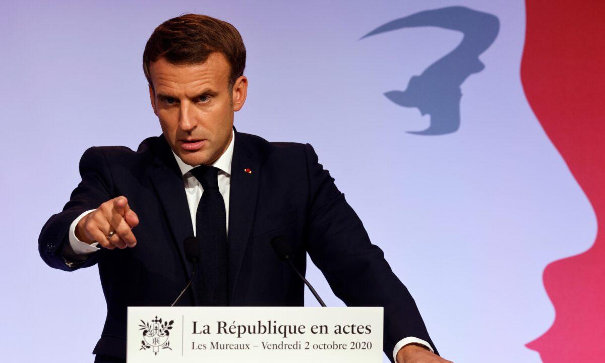French President Emmanuel Macron delivers a speech to present his strategy to fight Islamist separatism, in Les Mureaux, outside Paris, on Oct. 2, 2020. (Ludovic Marin/Pool via AP)