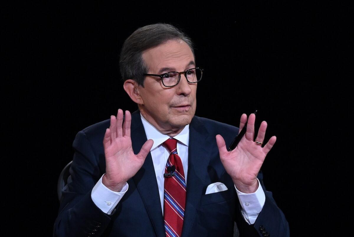 Debate moderator and Fox News anchor Chris Wallace directs the first presidential debate between President Donald Trump and Democratic presidential nominee Joe Biden at the Health Education Campus of Case Western Reserve University in Cleveland, Ohio, on Sept. 29, 2020. (Olivier Douliery-Pool/Getty Images)