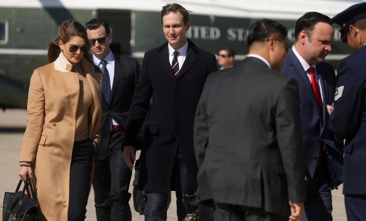 Hope Hicks, left, an adviser to President Donald Trump, President Trump's senior adviser, Jared Kushner, walk to Air Force One to depart Washington with the president and other staff on campaign travel to Minnesota from Joint Base Andrews, Md., on Sept. 30, 2020. (Leah Millis/Reuters)