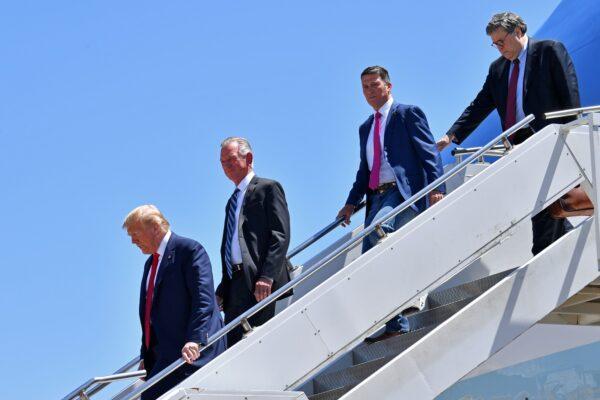 President Donald Trump steps off Air Force One, alongside Attorney General William Barr, right, Ronny Jackson, second from right, Republican nominee for Texas's 13th Congressional District, and Tommy Tuberville, Republican nominee for the United States Senate from Alabama, upon arrival in Dallas, Texas, on June 11, 2020. (Chip Somodevilla/Getty Images)