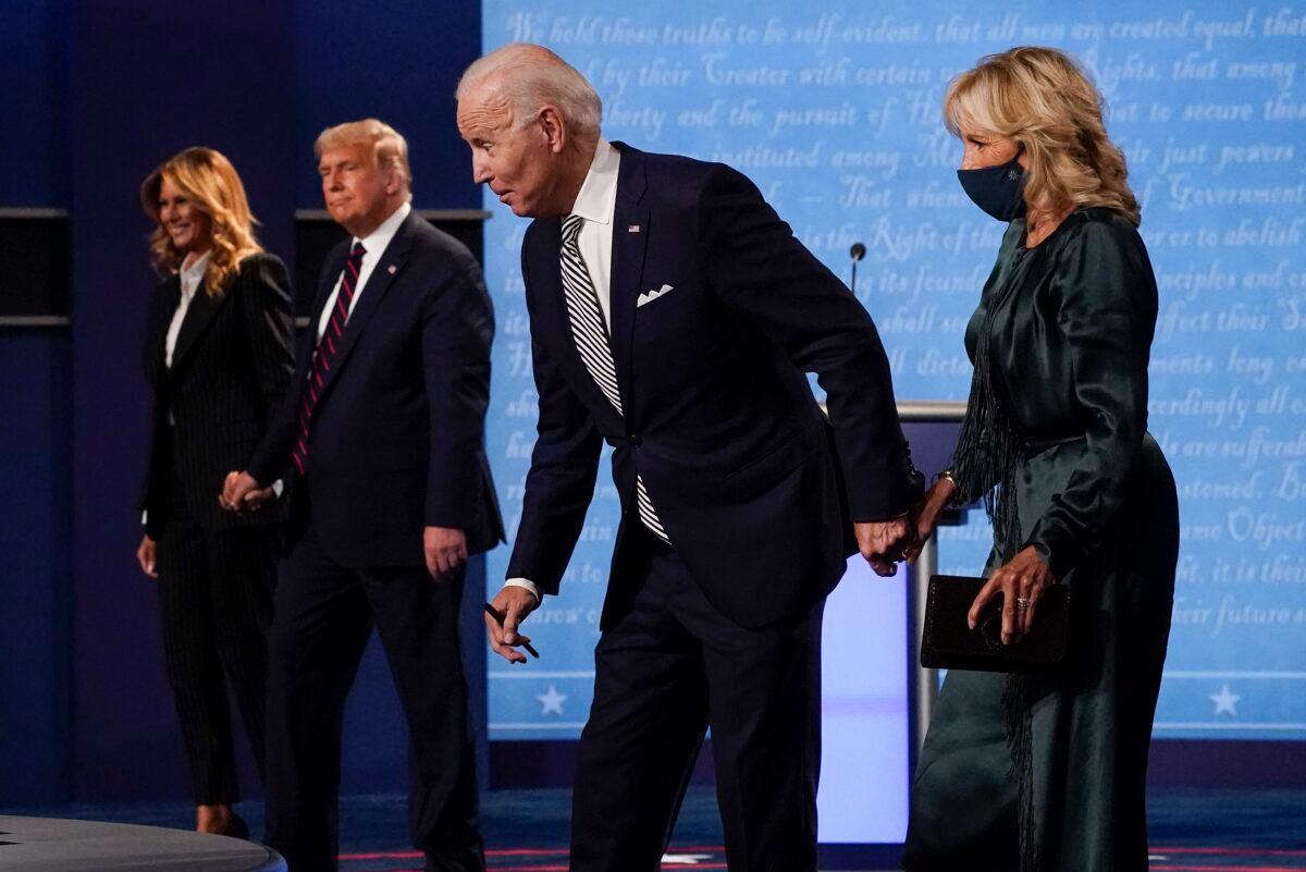 From left to right, First Lady Melania Trump, President Donald Trump, Democratic presidential nominee Joe Biden, and Jill Biden, walk off the stage at the conclusion of the first presidential debate, at Case Western University and Cleveland Clinic, in Cleveland, Ohio, Sept. 29, 2020. (Julio Cortez/AP Photo)