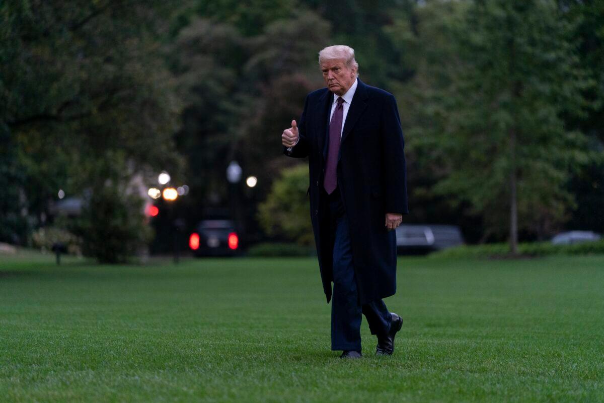 President Donald Trump gives the thumbs-up as he walks from Marine One to the White House in Washington as he returns from Bedminster, N.J., Oct. 1, 2020. (Carolyn Kaster/AP Photo)